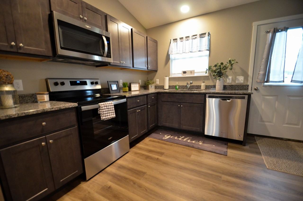 Ground level one and two bedroom units with private parking AND private laundry! - Photo 3 of 22