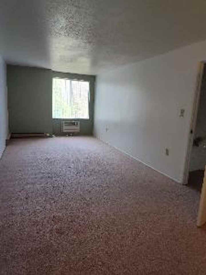 THE QUADS APARTMENTS - Photo 2 of 16