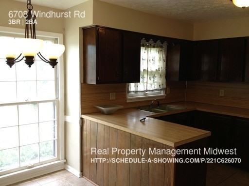 6708 Windhurst Rd - Photo 3 of 10