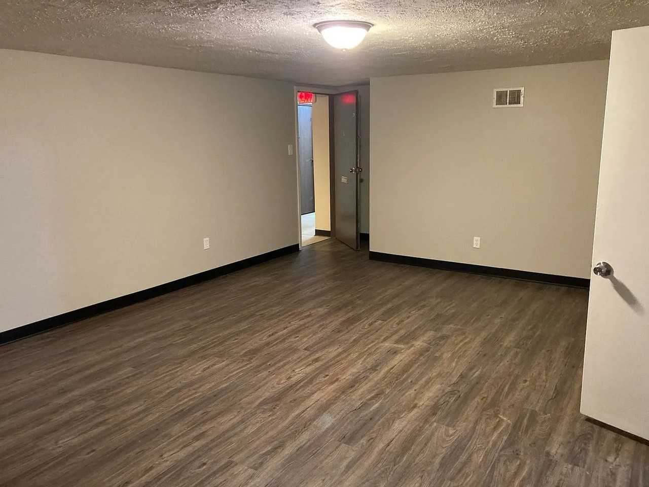 Regis Apartments - Photo 3 of 7