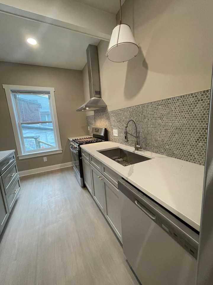 209-217 209-217 E Seneca Street - 215- Library - Photo 3 of 13