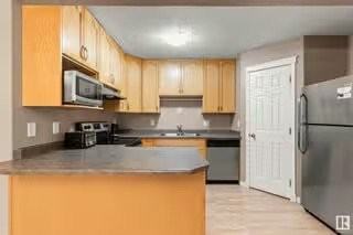 10910 University Ave Nw - Photo 3 of 5