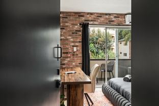 A 3 Bedroom, 2 Bathroom apartment with common areas and a fully functional kitchen at 1700 Malcolm Ave, Unit 204 - Photo 1 of 1