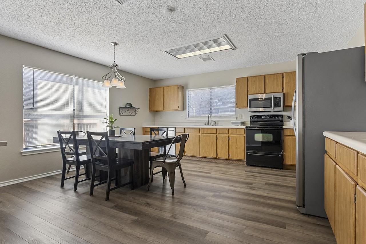 Charming Rue De Lis Home with Vaulted Ceilings & Fireplace - Photo 5 of 20