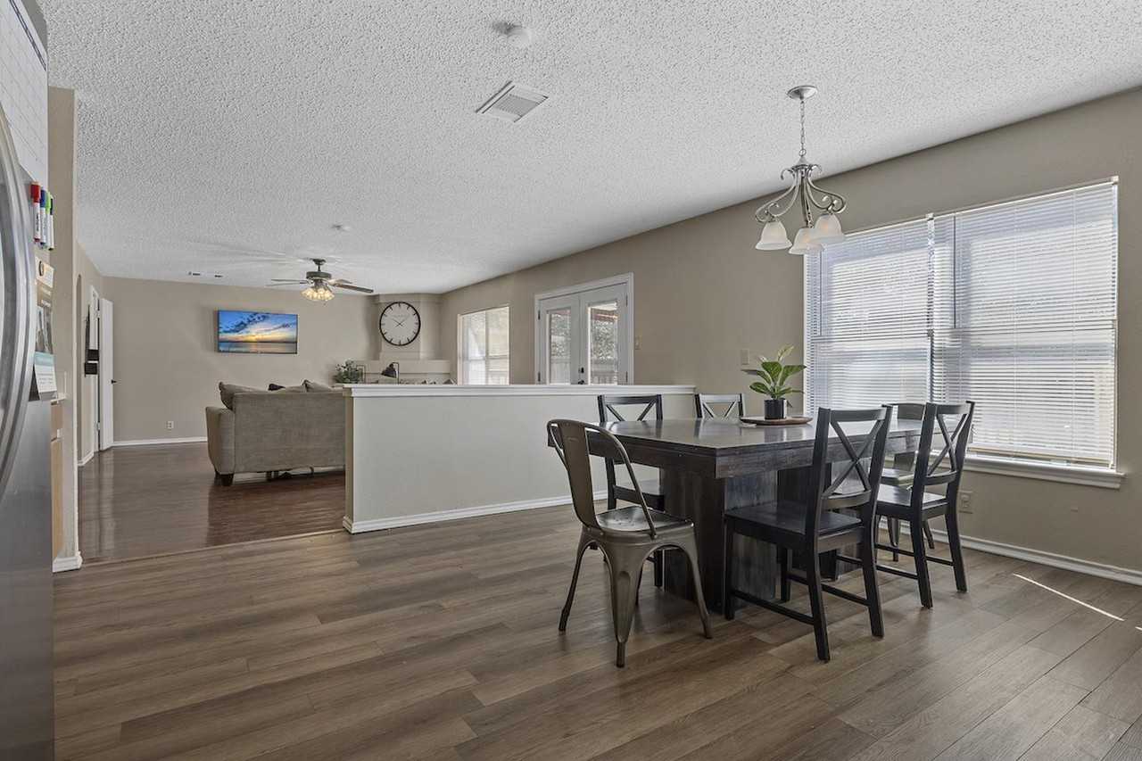 Charming Rue De Lis Home with Vaulted Ceilings & Fireplace - Photo 6 of 20