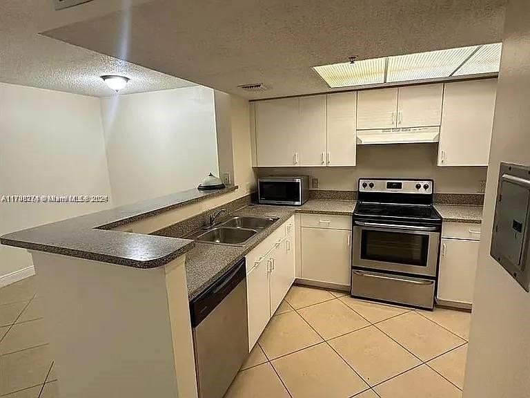 5001 Wiles Rd #101 - Photo 7 of 14