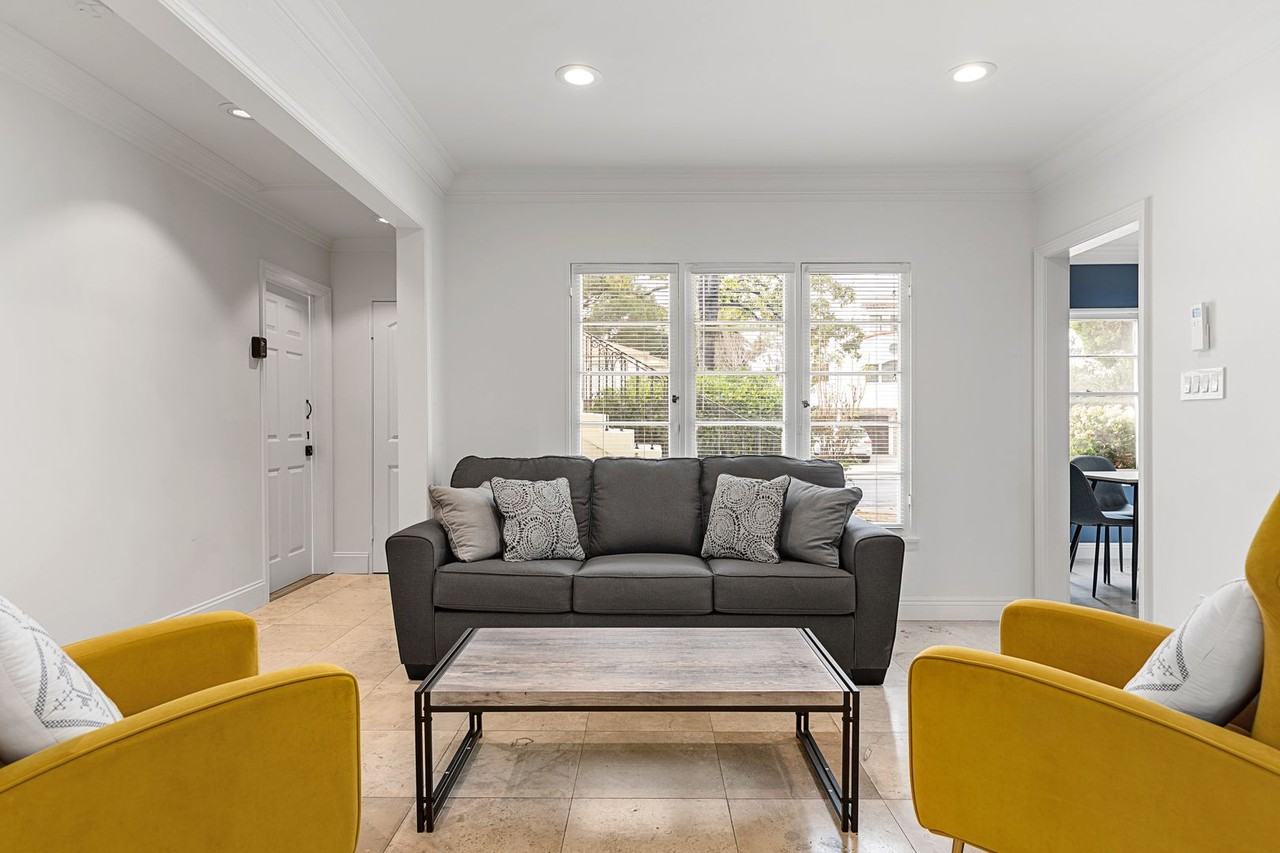 A 5 bedroom, 3 bathroom apartment with common areas and a fully functional kitchen at 1738 Kelton Ave. - Photo 7 of 22