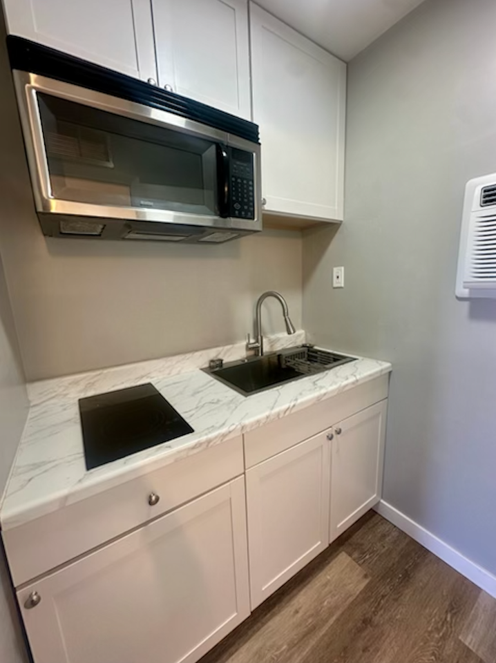 Clean, updated unit with utilities included - Photo 3 of 14