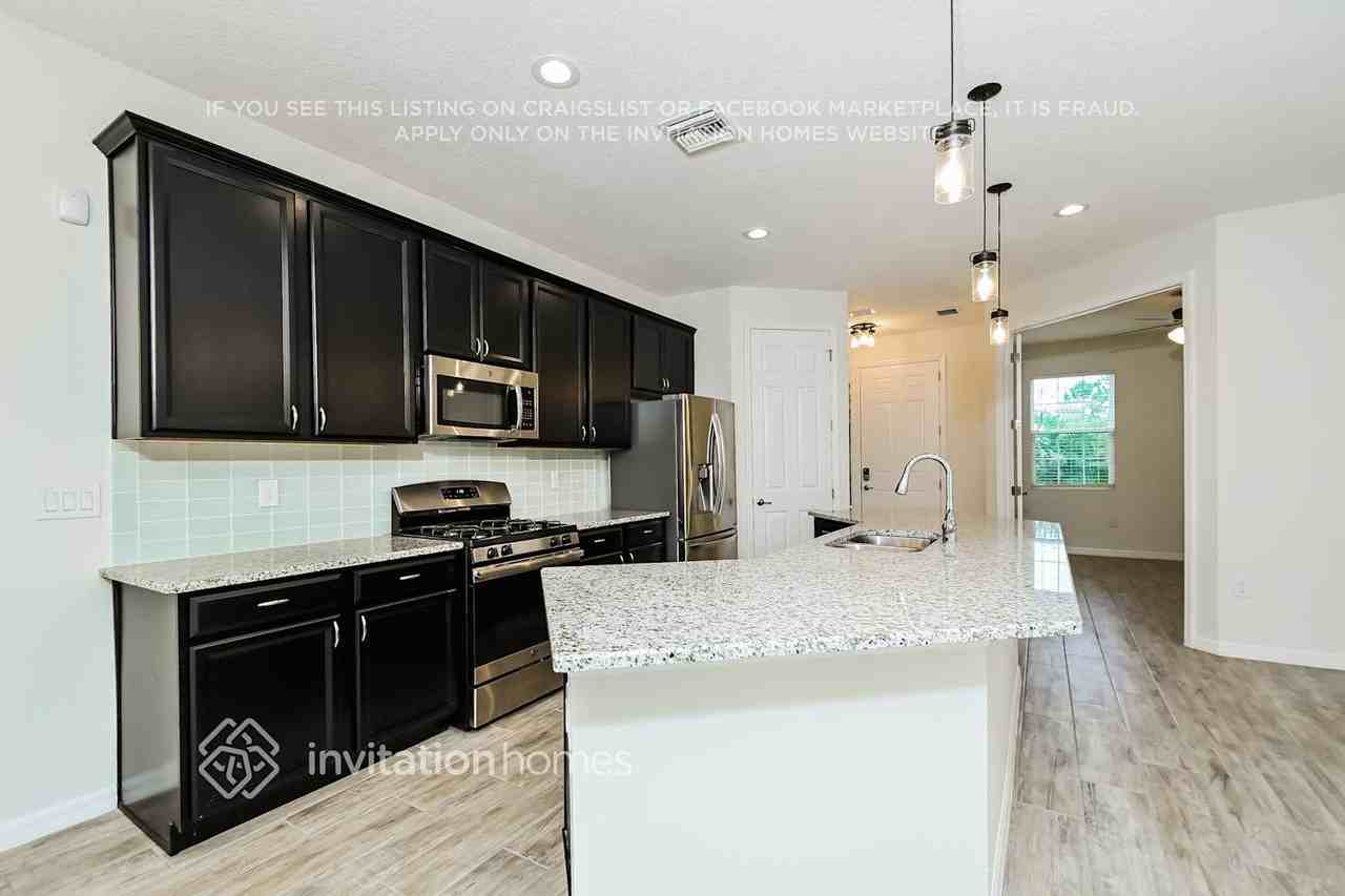 7115 Bowspirit Pl - Photo 4 of 16