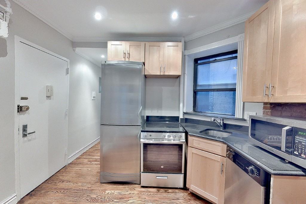 E 23rd St #1 - Photo 2 of 6