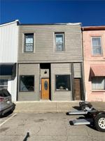 featured image of 104 E Washington St