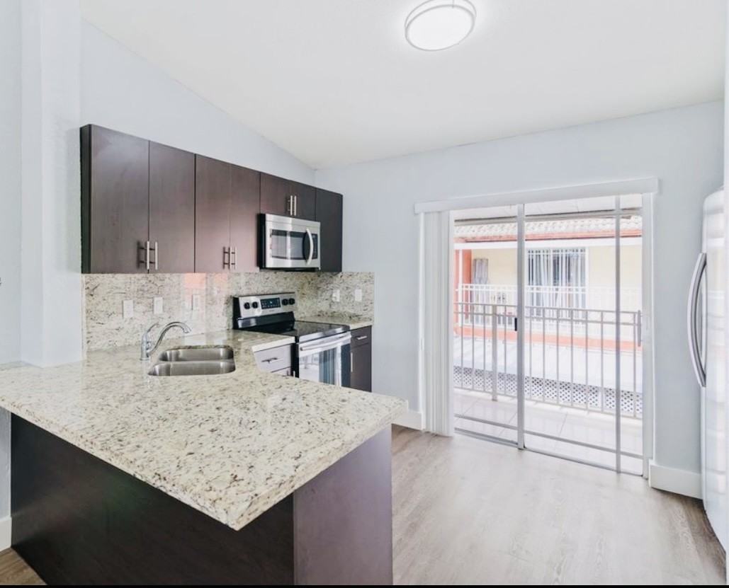 11043 W Okeechobee Rd #202 - Photo 2 of 5