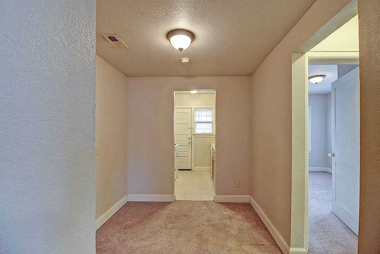 Historic Charm Meets Modern Comfort at Old English Court - Photo 4 of 13