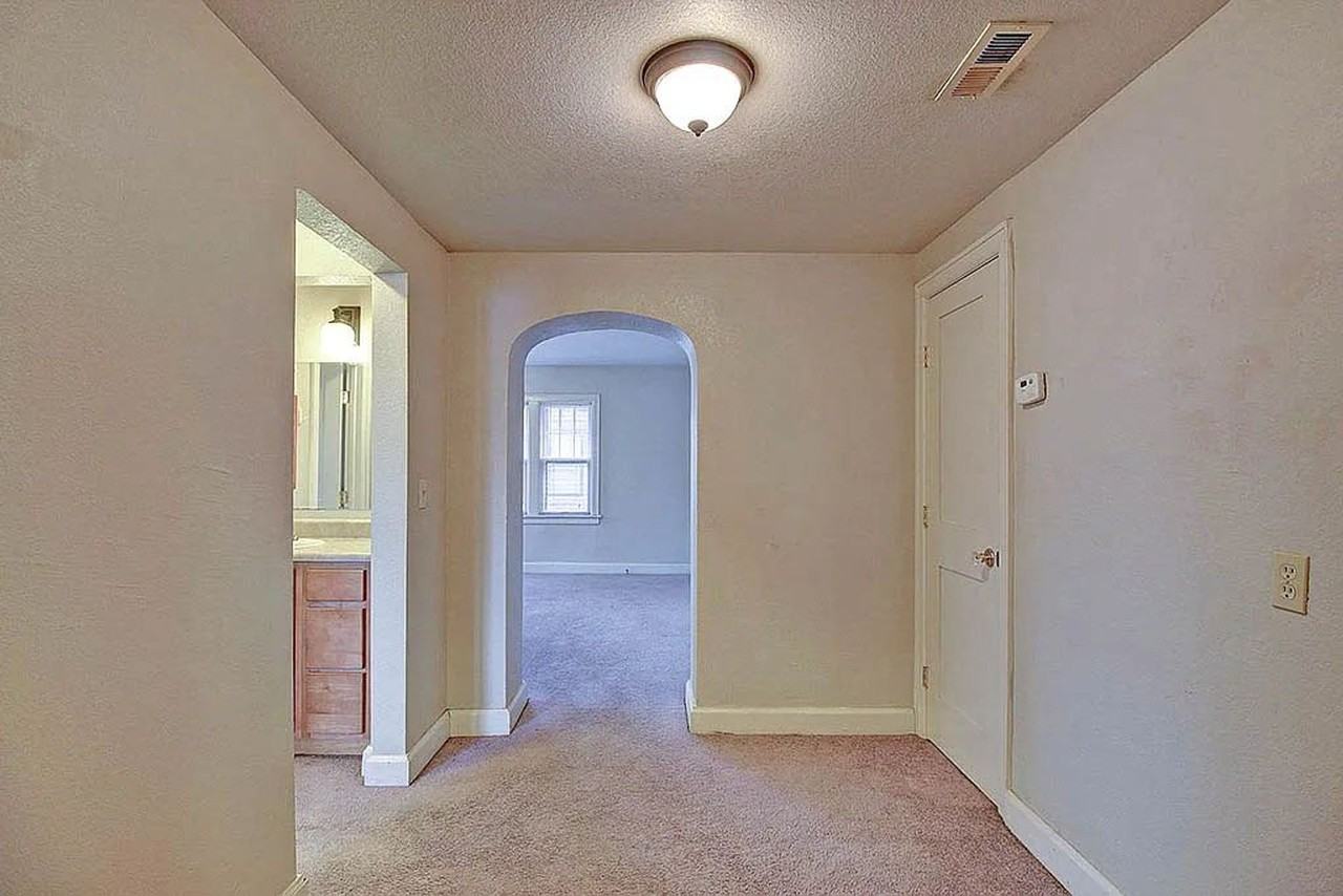 Historic Charm Meets Modern Comfort at Old English Court - Photo 6 of 13