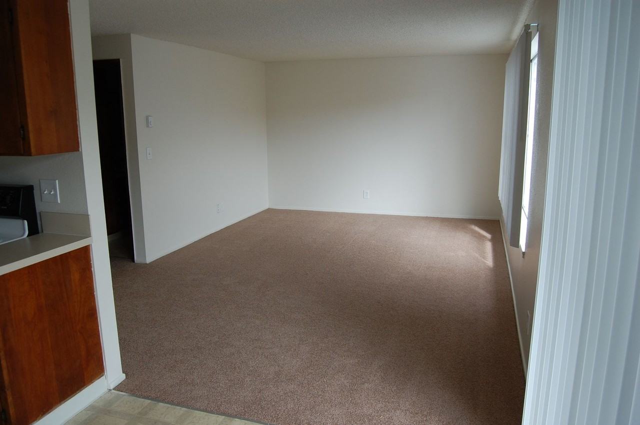 Spacious One & Two Bed Units in a Quite complex with Porches and Covered Off Street Parking - Photo 3 of 9