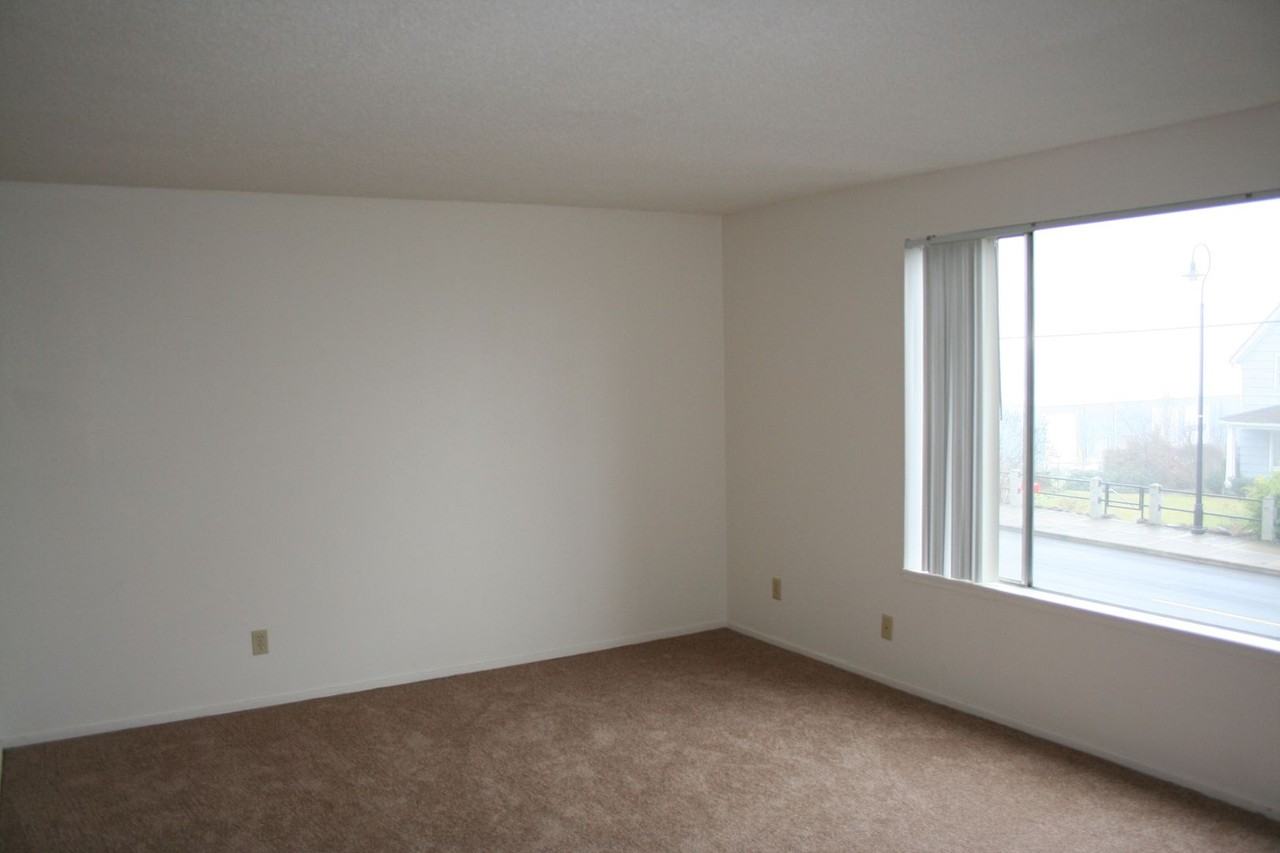 Spacious One & Two Bed Units in a Quite complex with Porches and Covered Off Street Parking - Photo 4 of 9