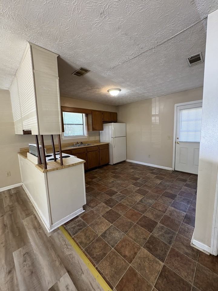 J-Estates--Collins Apts - Photo 3 of 5