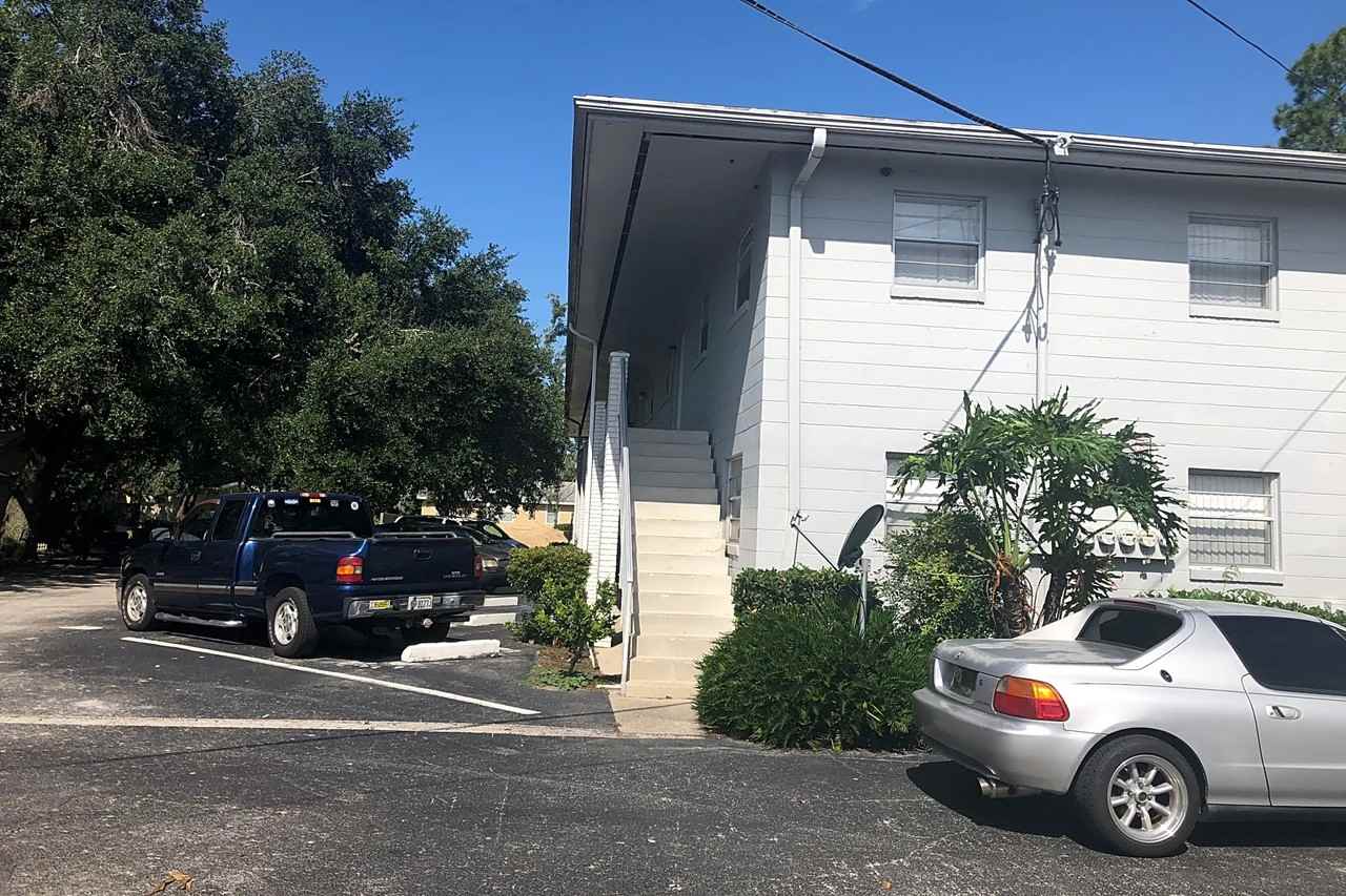 TIMUQUANA GARDENS - Photo 3 of 9