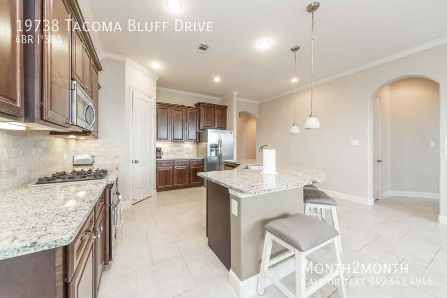 19738 Tacoma Bluff Dr - Photo 5 of 26