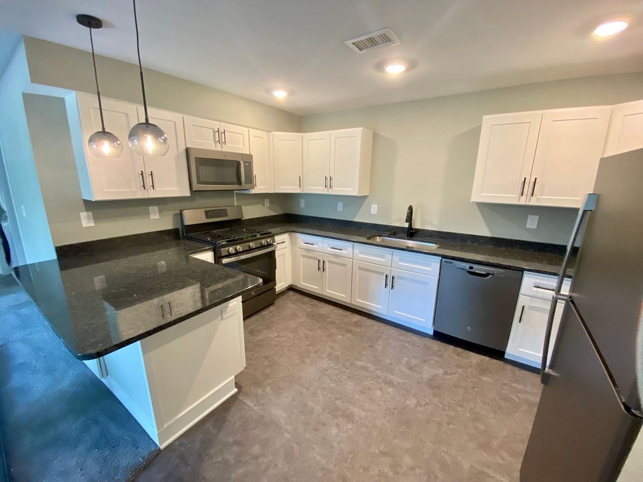 875 Houseman #1-12 - Photo 2 of 50