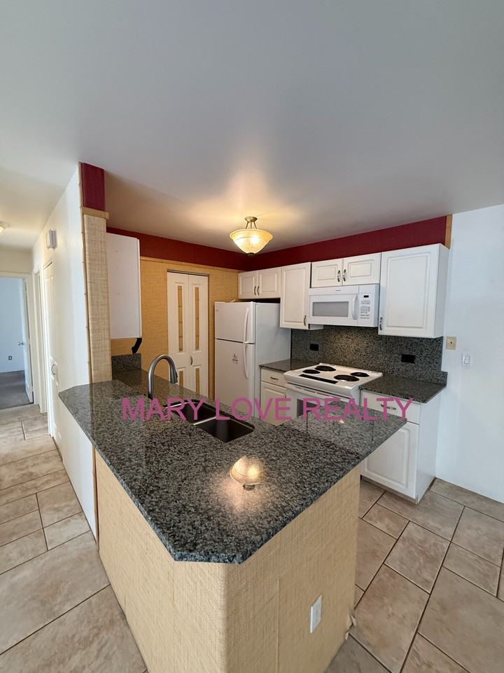 75 6081 Alii Drive #W103 - Photo 2 of 16
