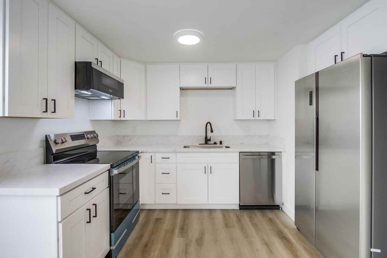 Two bedroom 1.5 bathroom beautifully upgraded with in unit laundry at the beach. Open House July 12 - Photo 2 of 10