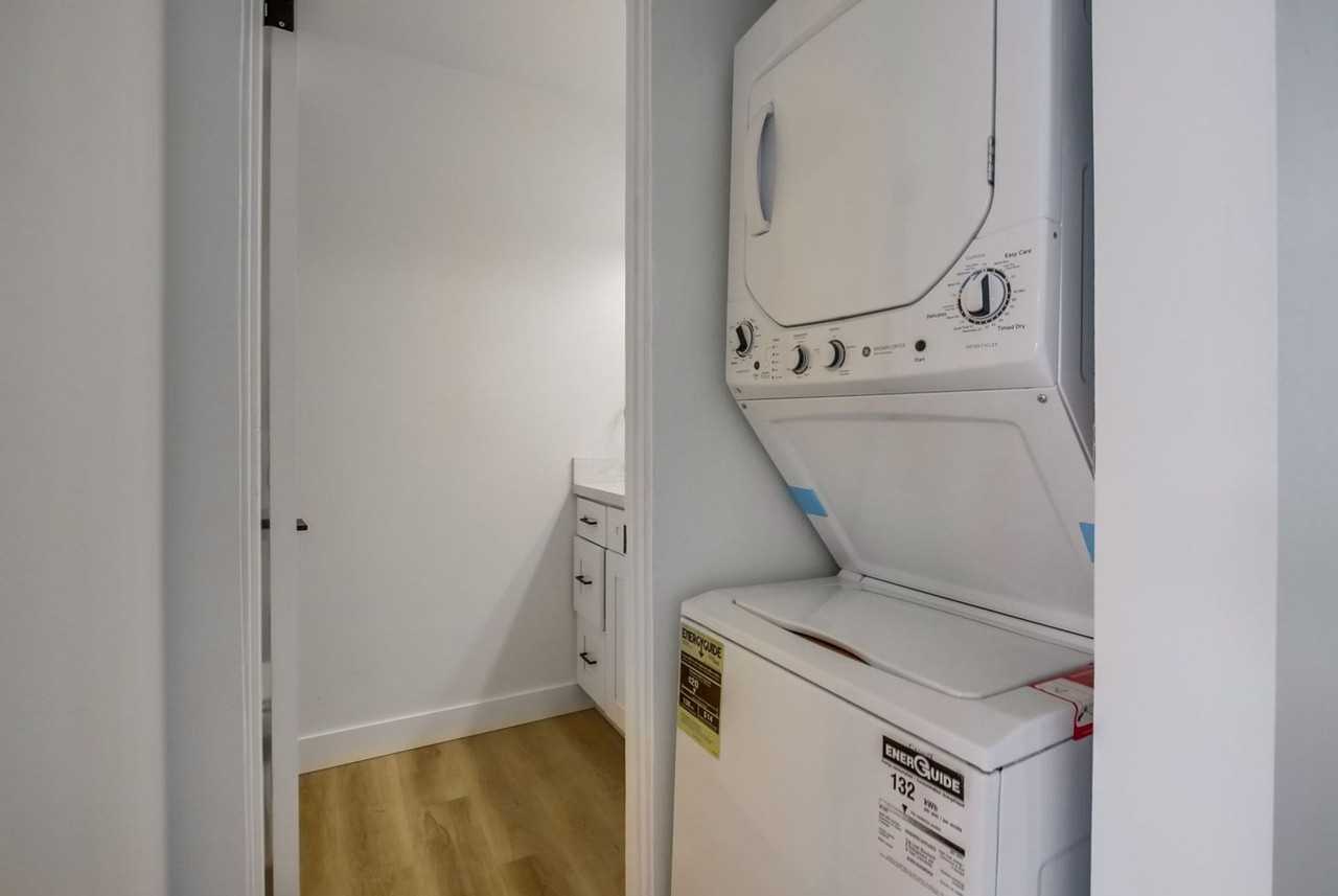 Two bedroom 1.5 bathroom beautifully upgraded with in unit laundry at the beach. Open House July 12 - Photo 7 of 10