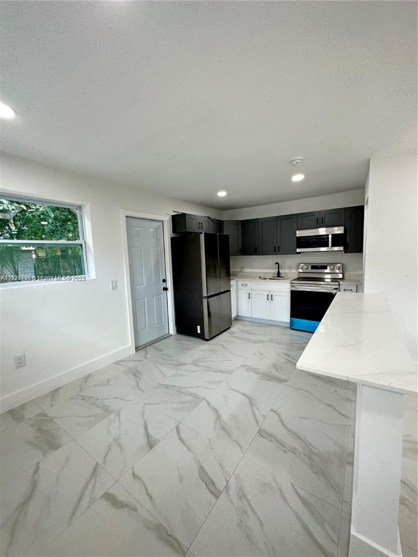 1445 Nw 34th St - Photo 2 of 9