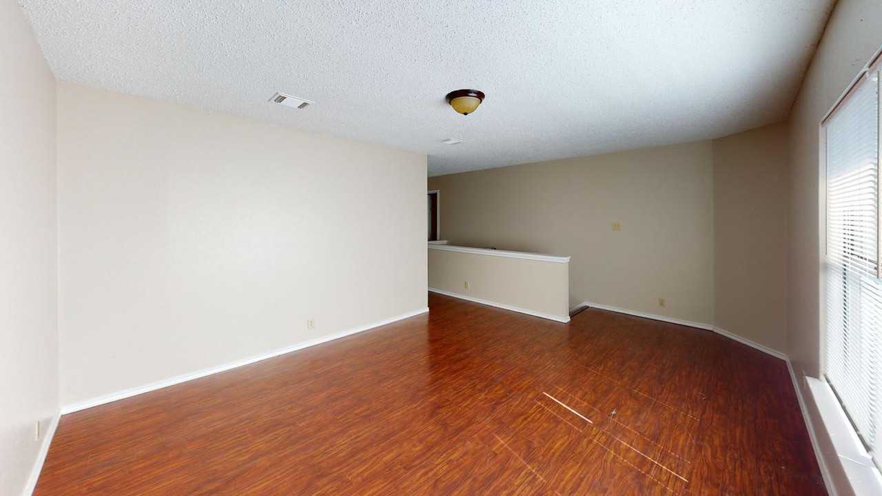 Charming Rue De Lis Home with Vaulted Ceilings & Fireplace - Photo 6 of 20