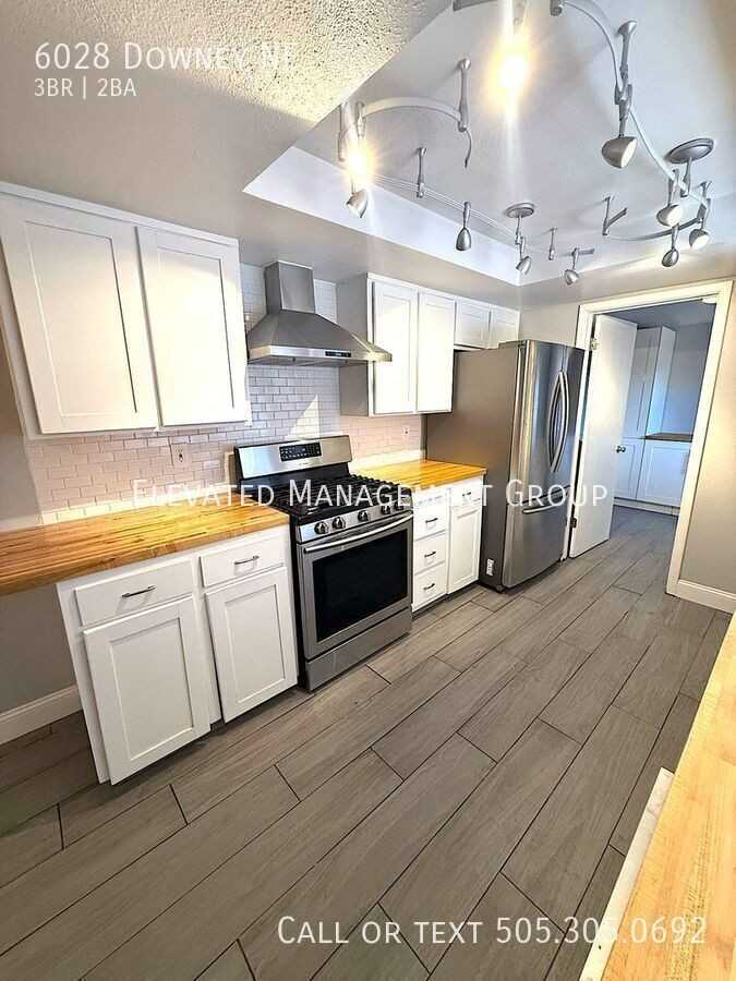 6028 Downey St Ne - Photo 2 of 32