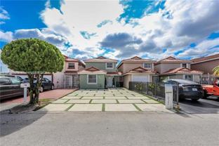 1021 1021 SW 104th Ct TH 1 - Photo 1 of 1