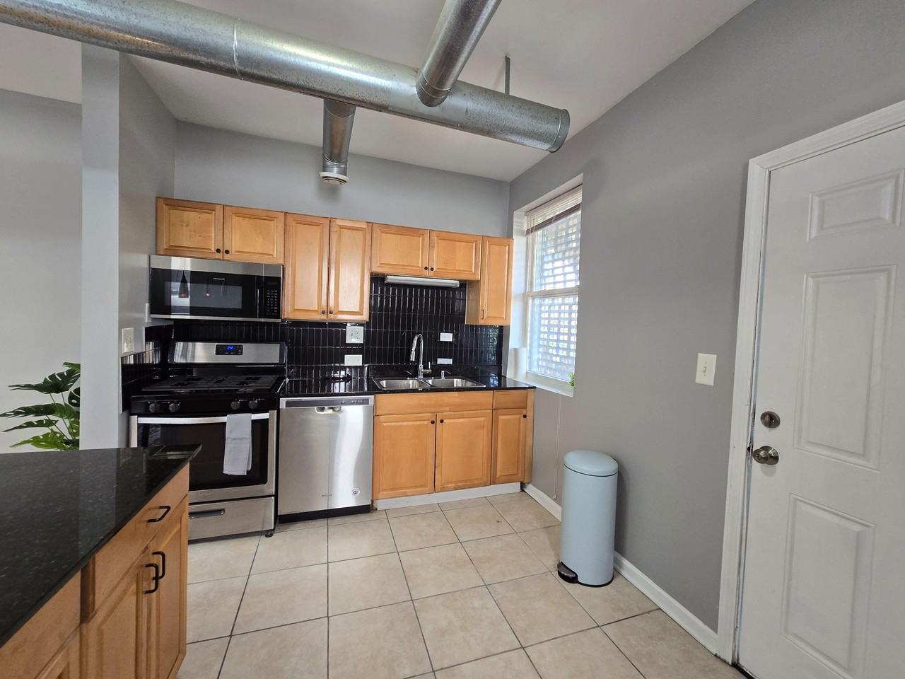 E 65th Pl - Photo 4 of 11