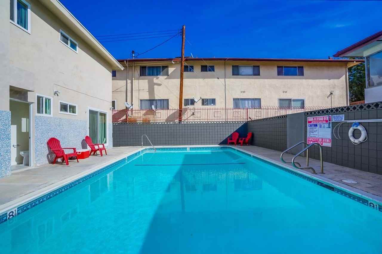 Retro Style Apartment Building with Pool and Gym - Photo 2 of 10