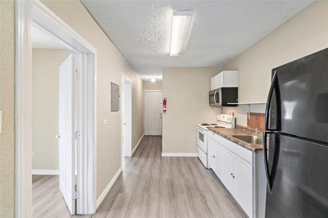 711 AVENUE A - Photo 3 of 8