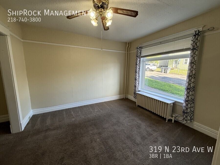 319 N 23rd Ave W - Photo 3 of 19