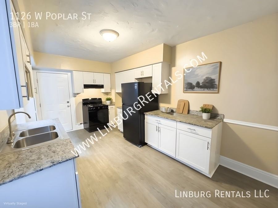 1126 W Poplar St - Photo 3 of 7