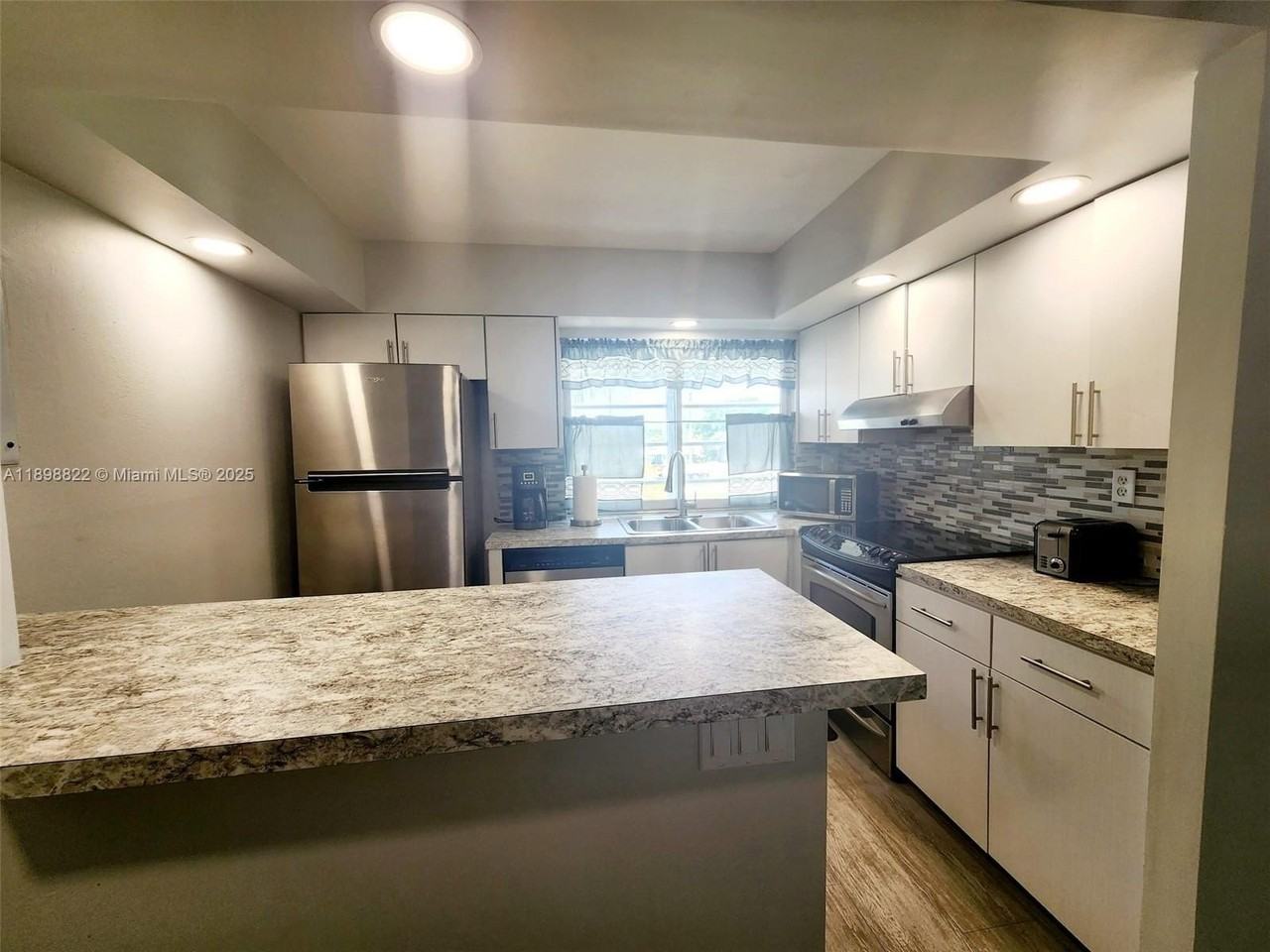 9101 Lime Bay Boulevard #305 - Photo 7 of 21