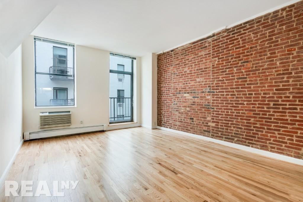 E 12th St #506 - Photo 2 of 6