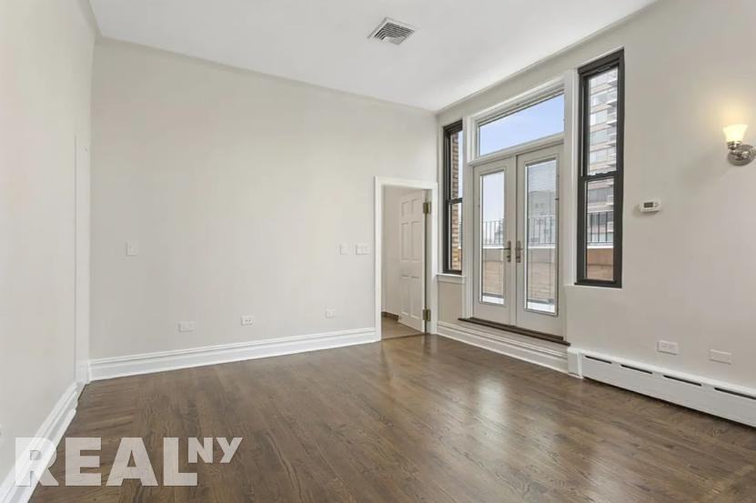 E 68th St - Photo 3 of 4