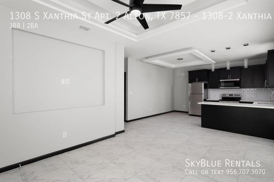 1308 S Xanthia St - Photo 3 of 12