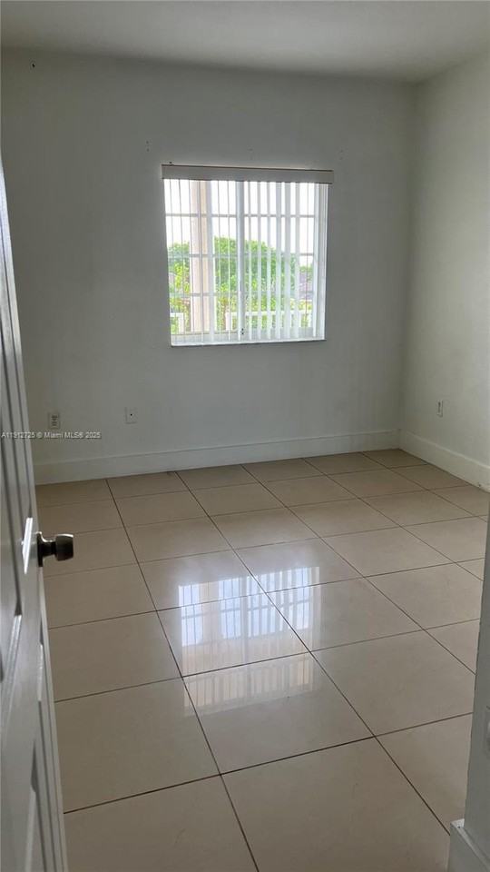 6940 Northwest 179th Street #302-7 - Photo 2 of 6