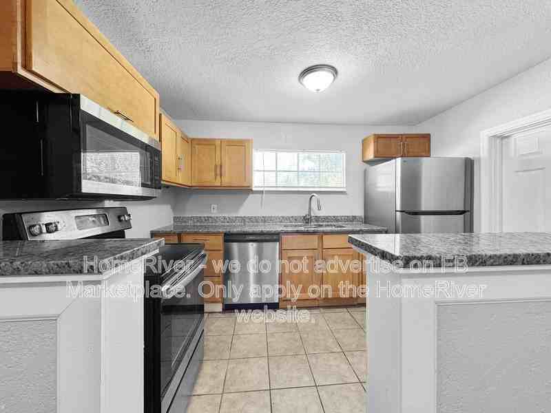 1410 E Waters Ave - Photo 4 of 19