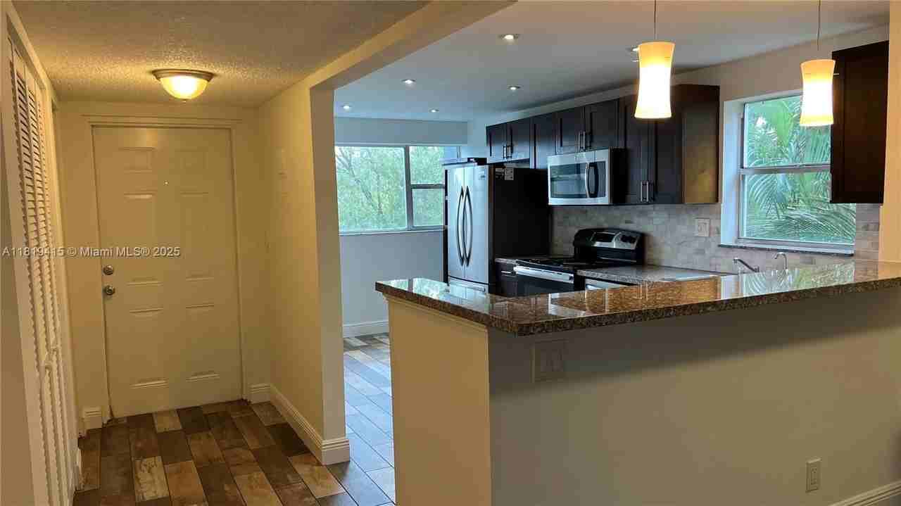 8300 Sands Point Blvd #K301 - Photo 3 of 24