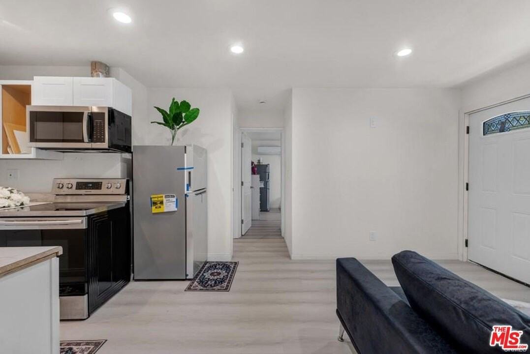 7705 Baird Ave - Photo 3 of 13