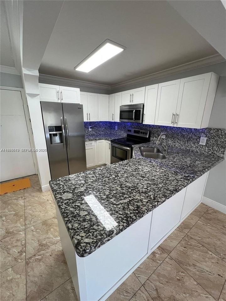 1075 W 68th St #218 - Photo 2 of 24