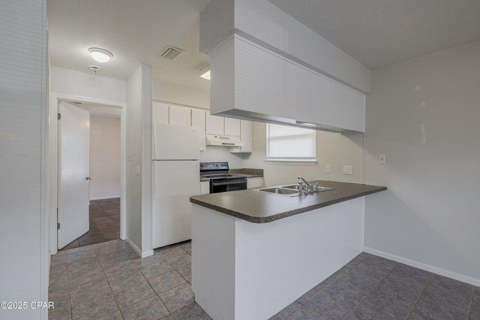 7813 N Lagoon Dr #1 - Photo 5 of 16