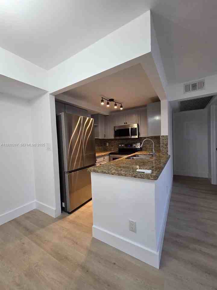 10023 Winding Lake Rd #104 - Photo 5 of 20