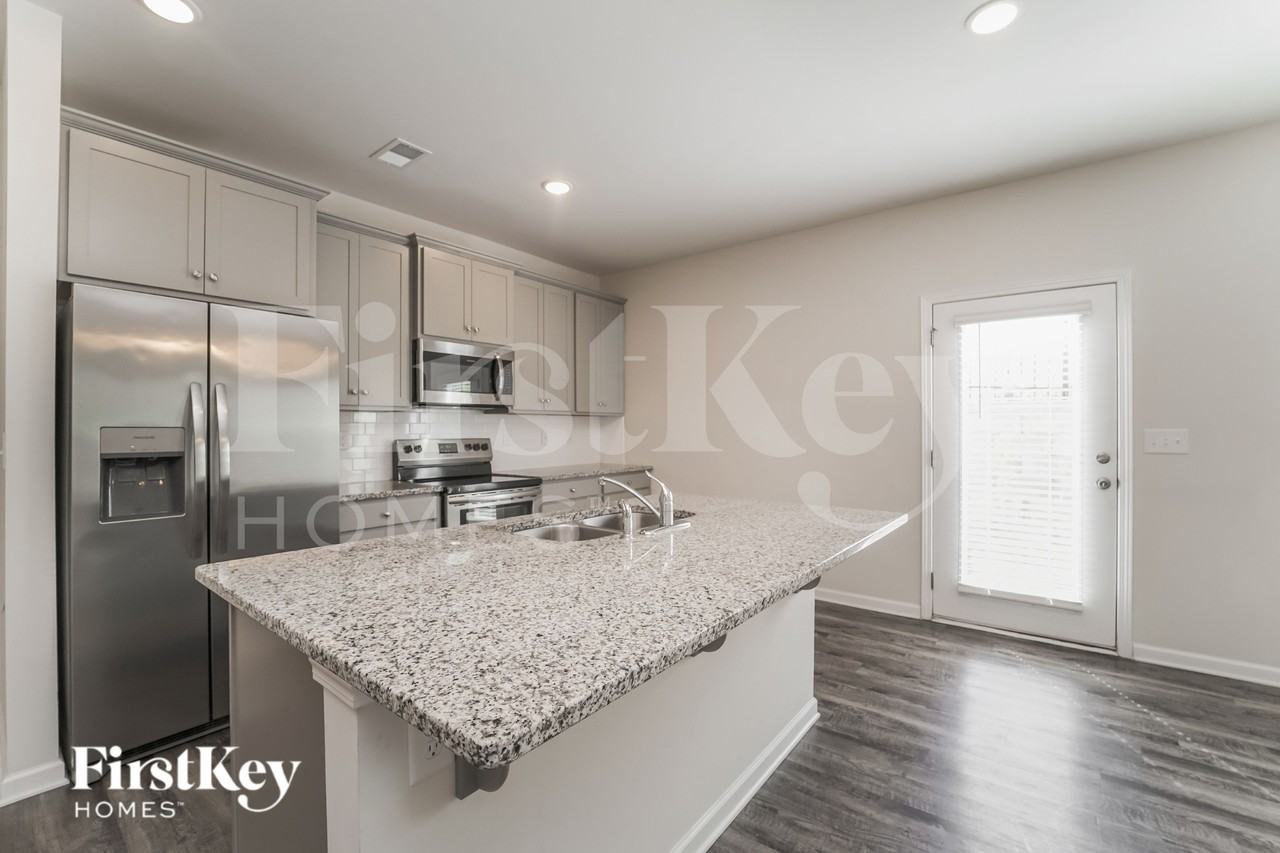 10714 Rivergate Dr NW - Photo 5 of 16