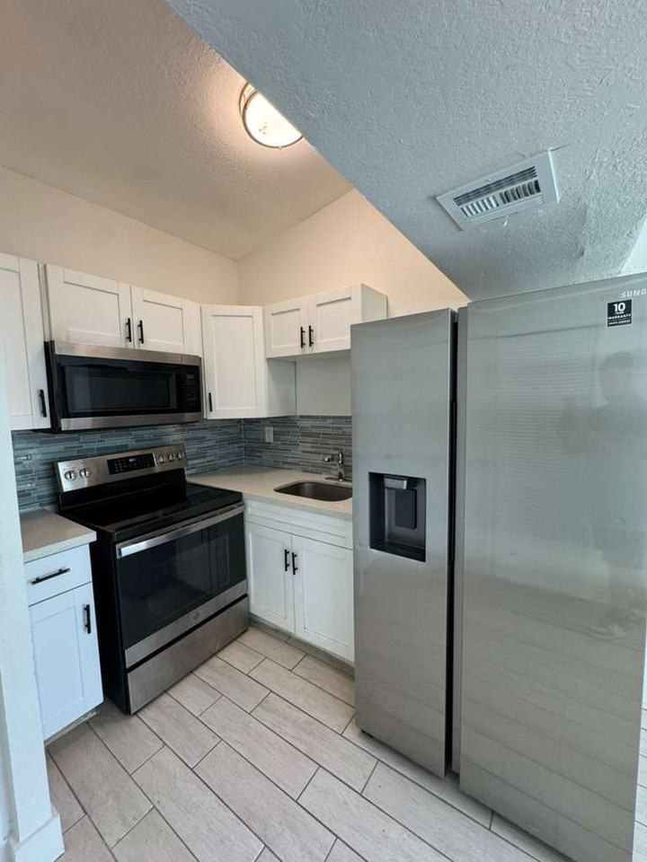 3039-3115 AVENUE J - Photo 3 of 11