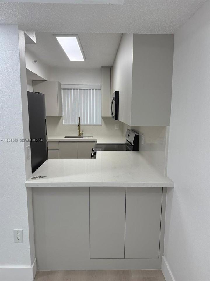 7835 W 30th Ct #G210 - Photo 3 of 14